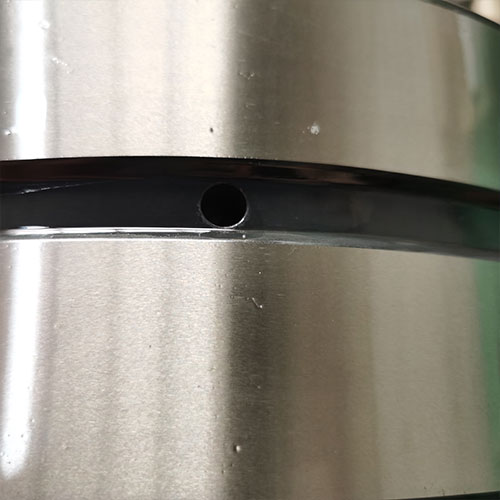 Precise treatment of oil holes to extend bearing life