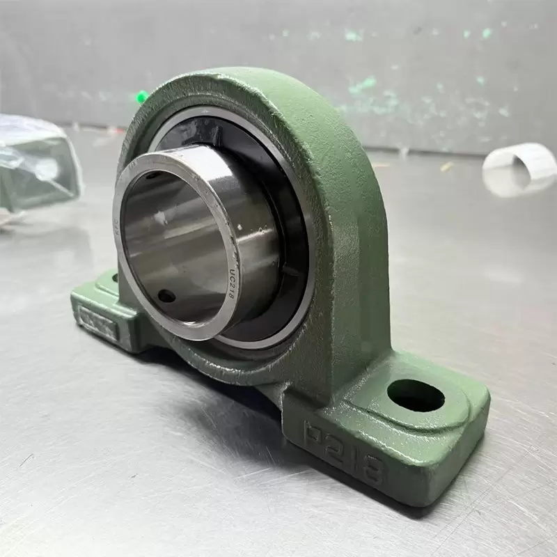 What are the materials used for the pillow block bearings?
